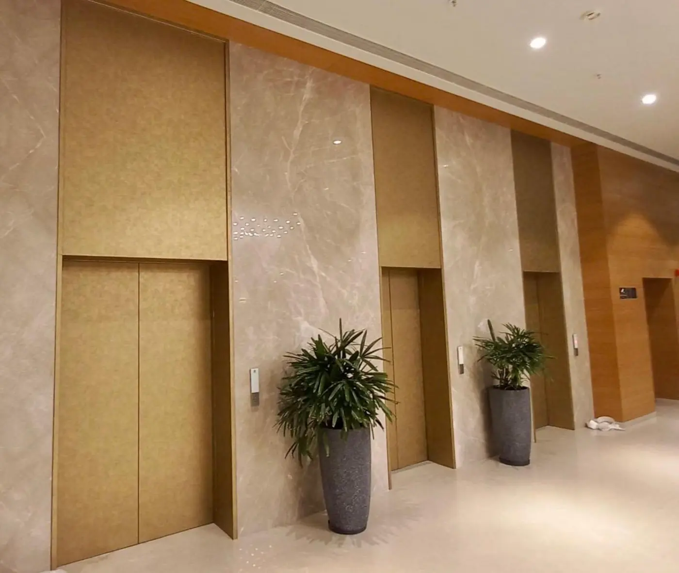 Clad panel finishes in a lift lobby