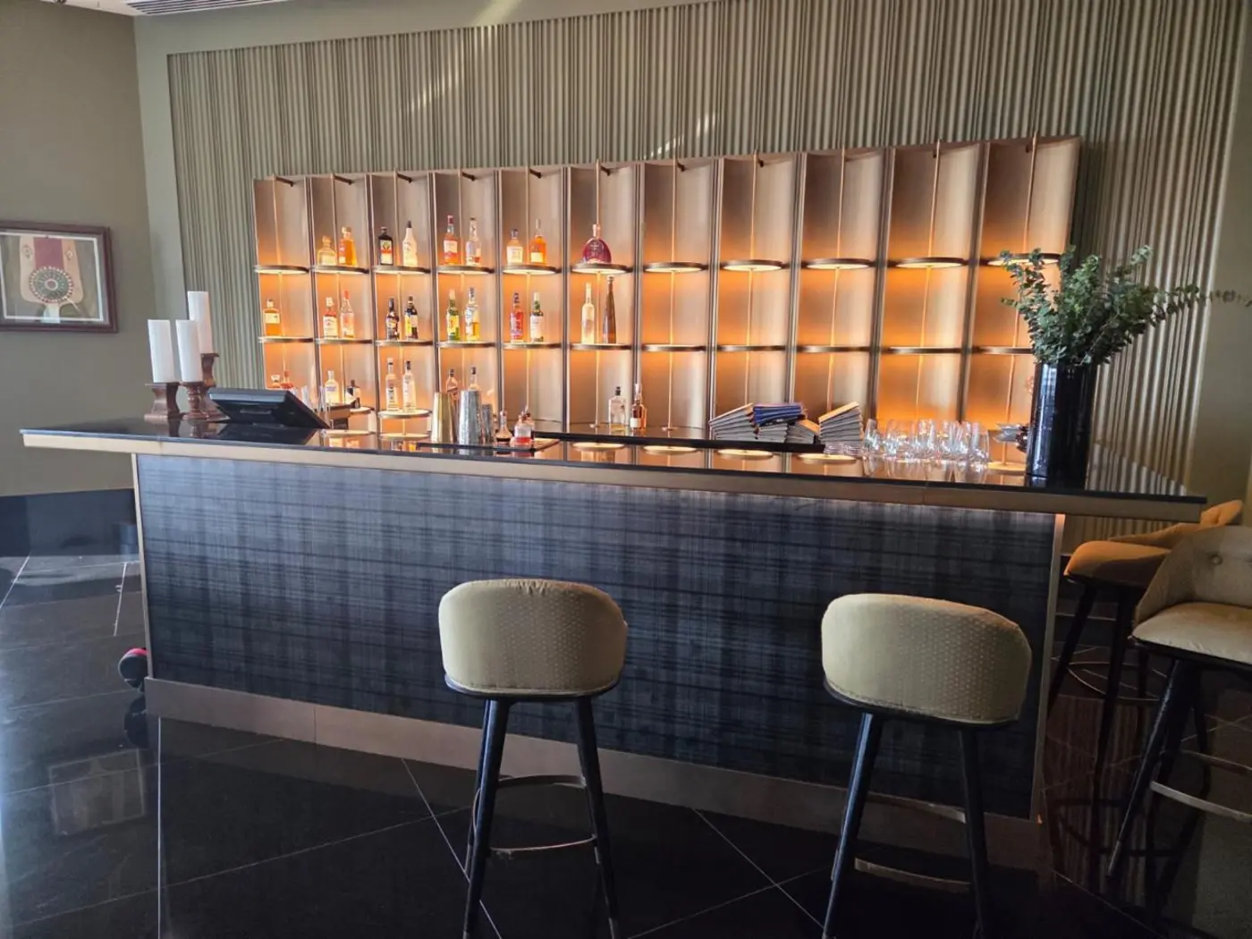 Textured panels behind a bar counter